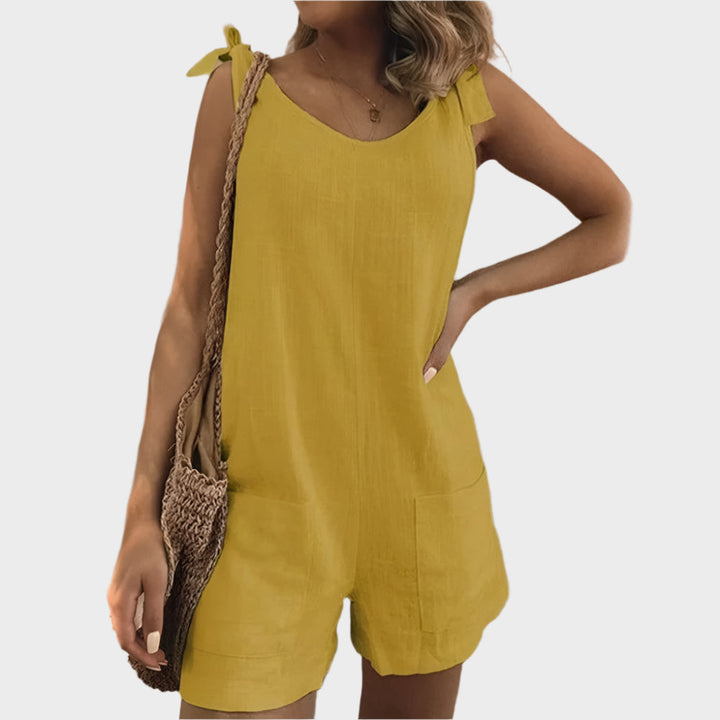 Potpuni kombinezon s kaiševima, mašnom i džepovima